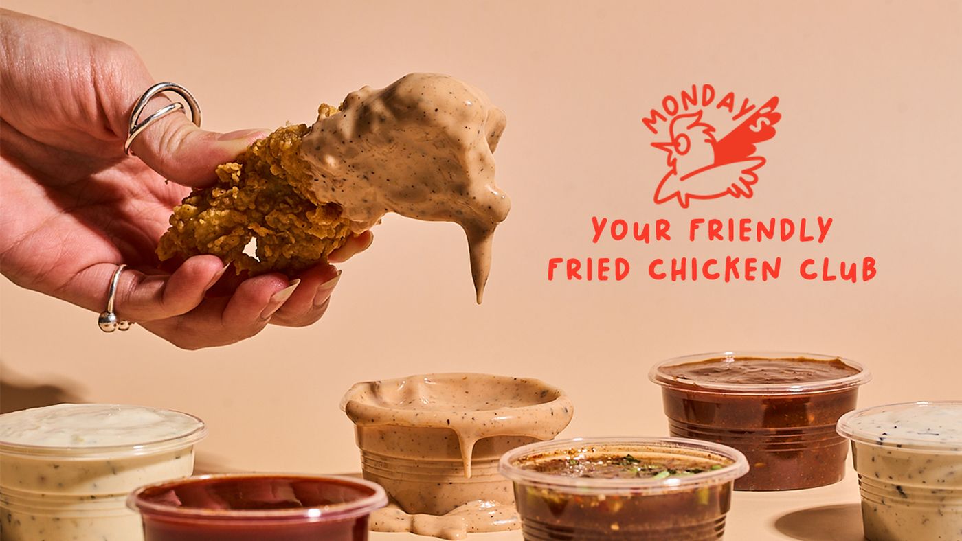 Fried chicken dipped in Monday's signature sauce, with all six house dips